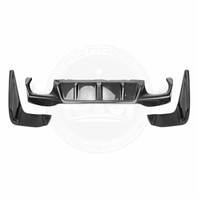Black car bumpers with a central grille piece arranged on a white background.
