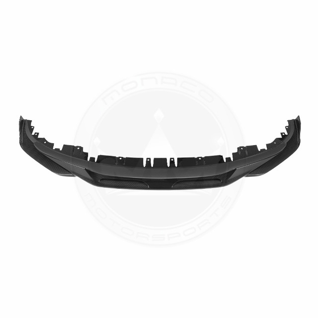 Black car bumper with integrated grille and vents on a white background.