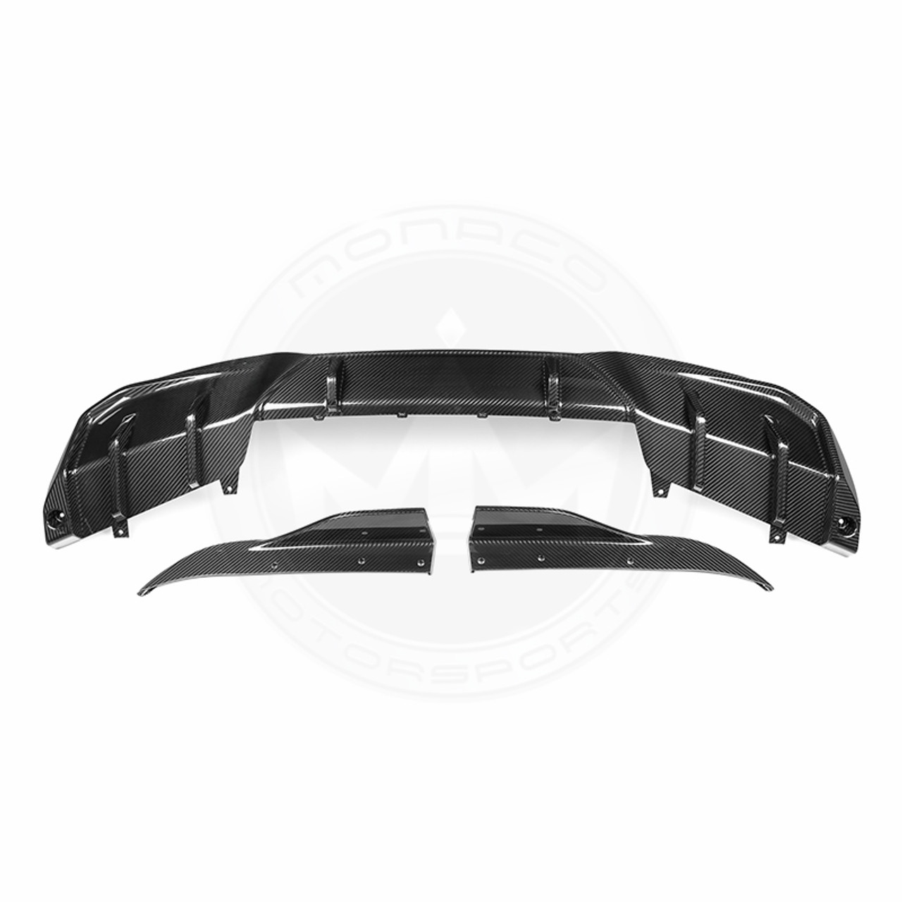 Black car rear diffuser with aerodynamic design.