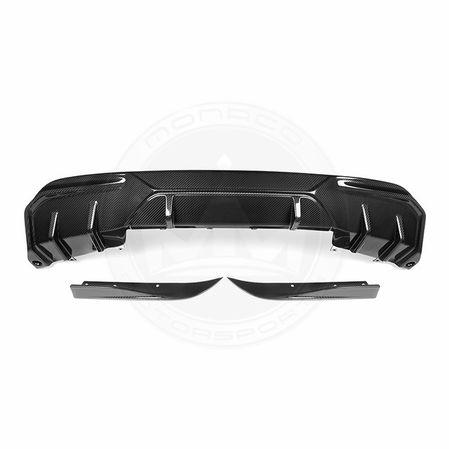 Black car rear diffuser with aerodynamic fins.